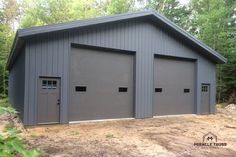 two garages are shown in the middle of a wooded area with trees behind them