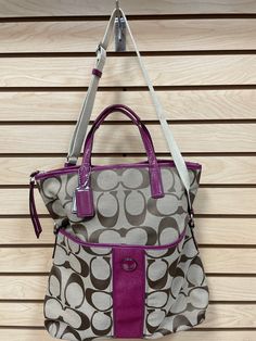 Dual satchel handles Adjustable crossbody strap Zipper closure Exterior magnetic snap closure pocket Exterior zip closure pocket 2 interior slip pockets Interior zip closure pocket Measures approximately 14" long x 15" high New with tags Coach Satchel, Purple Bags, Crossbody Bag, Satchel, Purple