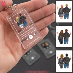 a person is holding a plastic keychain with pictures of people on it