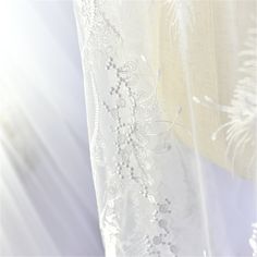 "This stunning Lace Fabric design piece has soft hand feel, It's perfect for weddings, bridal parties, and any events. Shop our large inventory of bridal fabrics. ☆PRODUCT DESCRIPTION : This gorgeous fabric is made on a sheer base with a beautiful flower embroidery throughout. The fabric width is approximately 51\" (130cm) Wide. Color: off-white as in picture Material: Rayon, Polyester ☆ PURCHASING INFORMATION: This fabric is sold by the yard and each Qty you enter will represent 1 yard of fabri Elegant Embroidered Tulle Gown, Embroidered Tulle Lace For Wedding, Tulle Gown With Intricate Embroidery For Wedding, Wedding Embroidered Fabric With Lace Work, Lace Wedding Dress With Floral Embroidery, Embroidered Lace Wedding Gown, Embroidered Organza Wedding Dress, Lace Embroidered Wedding Gown, Elegant Embroidered Organza Wedding Dress