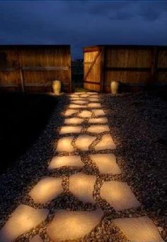 an image of a path made out of stones with the caption genius line a pathway with rocks painted in glow in the dark