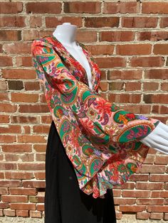 Gorgeous 70s inspired top with new style of repeating paisley psychedelic hippie pattern. Great summer time piece. Lovely brown and orange colors.  Front tie crop top with long bouncy butterfly sleeves. Material makes this a great summer time addition.with colors that are fun and eye-catching.  Easy to wear and you'll always look the great! Multiple ways to wear top, either tied in the front, wrapped around the waist and tied in the back or off shoulder. This top looks great paired with shorts, Bell Sleeve Wrap Top, Ruffle Sleeves Pattern, Front Tie Crop Top, Fairy Goddess, Boho Fairy, Flared Leggings, Brown And Orange, Tie Crop Top, Butterfly Sleeves