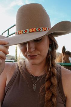 Inspired by the colors of the Grand Prismatic Hot Springs in Yellowstone, this beaded hatband was handmade in Montana using high quality glass seed beads. It contains turquoise, yellow, red, burnt orange, bright orange, and cream beads. It is 1/2" wide and 22.5" long. (Please measure the circumferance of your hat before ordering.) Finished with a leather and suede tie. Handmade Southwestern Multicolor Hats, Traditional Multicolor Beaded Hat Band, Handmade Multicolor Southwestern Hats, Multicolor Beaded Hats For Rodeo, Handmade Southwestern Multicolor Hat Band, Multicolor Beaded Hat With Curved Brim, Multicolor Beaded Brimmed Hat, Multicolor Beaded Short Brim Hat, Multicolor Bead Cap Hats For Festivals