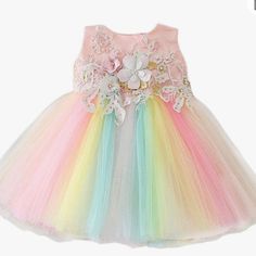 High Quality Tulle, Satin, Soft And Comfortable. Cotton Lining Is Breathable. Baby Girl Dress: This Baby Girls Dress Is Made With Multiple Pastel Colors Tulle. 7d Lace Flower, Hidden Zip On The Back, A-Line Tutu Dresses. Sweet Tulle Princess Dress For Dress-up, Sweet Tutu Dress For Dress-up, Cute Rainbow Princess Dress For Summer, Spring Princess Tutu Dress In Rainbow Colors, Spring Princess Tutu Dress In Rainbow, Cute Spring Baptism Dress For Party, Rainbow Tulle Dress For Spring, Princess Style Rainbow Tutu Dress For Spring, Pink Princess Dress For First Birthday In Spring