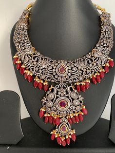 AD Red Stone Red Beads Dual Polish Neckline Necklace with Matching Screwback EarringsColor : Victorian and GoldenSize : Earring Length : 2 inches;Stones : AD Red Stone Pearls Red Beads Ceremonial Red Jewelry Sets With Stone Work, Red Kundan Necklace With Gemstone For Gift, Elegant Red Multi-stone Jewelry, Red Kundan Gemstone Necklace, Traditional Red Multi-stone Jewelry, Necklace For Neckline, Traditional Necklace, Necklace Traditional, Red Beads