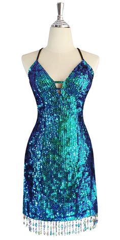 Glamorous Blue Sequin Mermaid Dress, Glamorous Green Sequin Dress For Cocktail, Glamorous Green Sequin Cocktail Dress, Glamorous Green Sequin Fabric, Blue Sequined Mermaid Dress For Night Out, Glamorous Green Embellished Mermaid Dress, Glamorous Fitted Green Sequin Fabric, Green Glitter Dress For Night Out, Glamorous Green Sequin Dress With Contrast