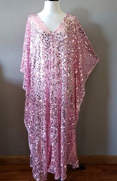 Made to order...Pink Sequin Caftan DressLarge iridescent round sequinPink Sheer lightweight fabricOversized kimono style sleevesOne Size Fits MeasurementsWidth: 46" (armpit to arm pit)Total Length : 50-56" CareHand Wash Cold Please allow me 2-3 business days to make the item prior to shipping. Summer Party Dress With Batwing Sleeves, Festive Pink Kaftan With Kimono Sleeves, Summer Festive Sequined Kaftan, Summer Party Kaftan, Free Size, Summer Party Kaftan In Free Size, Summer Party Embellished Kaftan, Party Festival Sequins Kaftan, Summer Long Sleeve Kaftan For Parties, Summer Long Sleeve Party Kaftan