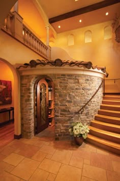 an entry way with stone steps leading up to the second floor