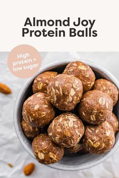 almond joy protein balls in a bowl with the words high protein and low sugar on top