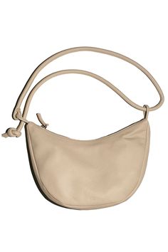 A soft form crescent shaped bag in vegetable tanned semi-aniline cowhide, 100% leather. Shown here with the strap doubled, but can be lengthened. 11" wide, 7" tall at center, 2" deep with a 40" total strap length. Zip closure. Leather Baguette Bag With Round Handle For Everyday, Beige Leather Saddle Bag With Leather Handles, Leather Hobo Bag With Round Handle For Travel, Everyday Shoulder Bag With Smooth Grain And Round Handle, Leather Hobo Bag With Adjustable Strap And Round Handle, Everyday Shoulder Bag With Leather Lining And Round Handle, Everyday Shoulder Bag With Round Handle And Leather Lining, Beige Leather Baguette Bag With Adjustable Strap, Versatile Leather Hobo Bag With Round Handle