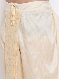 VM By VASTRAMAY Men's Gold Embroidered Dhoti Pant The VM By VASTRAMAY Men's Gold Embroidered Dhoti Pant is a perfect blend of traditional aesthetics and modern comfort. Designed with intricate embroidery, this dhoti pant is ideal for festive occasions, weddings, and cultural events. The luxurious gold hue adds a regal touch to your attire, making you stand out in any crowd. Key Features Elegant gold color with intricate embroidery Comfortable fit for all-day wear Perfect for festive and cultural Traditional Harem Salwar Kameez For Festivals, Traditional Pants With Embroidered Border For Festivals, Traditional Eid Bottoms With Drape, Traditional Drape Bottoms For Eid, Traditional Embroidered Bottoms For Diwali, Traditional Trousers For Eid, Traditional Pants With Embroidered Border For Eid, Traditional Harem Pants For Festive Occasions, Traditional Harem Pants With Festive Drape