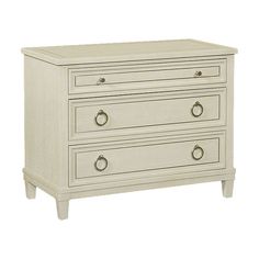 a white dresser with three drawers and two pulls on the bottom drawer, against a white background