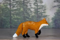 a stuffed fox is standing on the floor