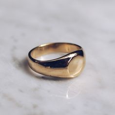 Gold toned brass Small Minimalist Ring in sizes for both men and women. This simple ring has a circular flat face but lot's of style and flat top rings are definitely in right now! Available in 925 Sterling Silver https://etsy.me/2sLAcwj Available in Larger Style https://etsy.me/2CEYcpw Ring Size Available in all sizes. Please be sure to find your exact ring size for the finger you want before ordering. See image chart above or you can use the chart on my website as a guide - https://jewelrylab. Minimalist Gold Engraved Ring For Everyday, Modern Gold Brass Signet Ring, Gold Brass Signet Ring For Everyday, Everyday Recycled Gold Tarnish Resistant Signet Ring, Everyday Tarnish Resistant Recycled Gold Signet Ring, Classic Everyday Brass Signet Ring, Gold Minimalist Dome Ring In Brass, Minimalist Gold Dome Ring In Brass, Everyday Brass Signet Ring