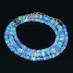 "Natural Ethiopian Blue Fire Opal Smooth Rondelle Beads Necklace Gemstone Type : Natural Item Code : 149 Origin-:100% Natural Blue Fire Opal Necklace Grade-: AAA++ Stone shape-: Smooth Rondelle Beads Stone color-: Same As Picture Metal-: Length-: 16 Inch Quantity-: 1 Strand Necklace Approx Weight : 45.10 Carat Approx Size : 3 TO 5 MM 100% Genuine & Natural If you want More Quantity in Any Necklace then you can get it in our company. ABOUT US skgemsstone based in Jaipur, India is a company en Blue Gemstone Beads Necklaces For Party, Blue Gemstone Beads Necklace For Party, Blue Rondelle Beaded Bracelets With Polished Beads, Blue Rondelle Beads For Jewelry Making, Blue Gemstone Beaded Necklaces For Party, Blue Bohemian Rondelle Jewelry, Blue Rondelle Necklace With Faceted Beads, Blue Rondelle Beaded Necklace With Spacer Beads, Blue Rondelle Beads