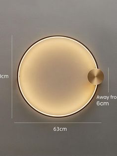 an image of a round light fixture with measurements for the size and width in front of it