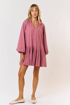 Cute and easy to wear- Our Marla Dress features puff long sleeves with bottom pleating. 100% cotton Flowy V-neck Dress With Smocked Cuffs, Spring V-neck Dress With Puff Gathered Sleeves, V-neck Pleated Puff Sleeve Dress, Billowy V-neck Puff Sleeve Dress With Gathered Sleeves, Pink V-neck Dress With Gathered Sleeves, Puff Long Sleeve Dress, Maxi Romper, Crop Top Sweatshirt, Puff Long Sleeves