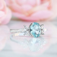 Gorgeous Eva Aquamarine Ring ►Made of solid sterling silver with rhodium finish (925) ►Accented with simulated diamonds (CZ) ►Average band width: 1.8 mm Center Stone: Aquamarine Stone Creation: Created (can be made with a natural aquamarine at additional cost) Stone Cut: Oval Gem size: 7.0 x 9.0 mm Carat Weight: 1.4 ct. (approx.) ✓ 100% Nickel-Free ✓ Hypoallergenic ✓ Comfort Fit ✓ Free Ring Box ✓ Free USA Shipping ✓ Ready to ship next business day Three-stone Aquamarine Jewelry For Gift, Three Stone Aquamarine Jewelry For Gift, Three Stone Aquamarine Jewelry As A Gift, Aquamarine Three Stone Jewelry For Anniversary, Three Stone Aquamarine Jewelry For Anniversary, Aquamarine Ring With Center Stone, Anniversary Three Stone Aquamarine Jewelry, Aquamarine Diamond Ring With Center Stone As Gift, Oval Aquamarine Promise Ring