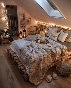 an attic bedroom is decorated with string lights