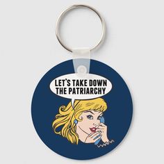 a round keychain with the words, let's take down the patriachy