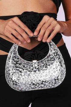 Elevate your style with this Diamond Glass Handbag – a captivating accessory that adds a touch of glamour to your ensemble. Crafted with meticulous detail and adorned with sparkling diamonds, this handbag is the perfect choice to enhance your charm at upscale events, cocktail parties, and fashionable gatherings. Trendy Top Handle Shoulder Bag For Party, Trendy Handheld Shoulder Bag For Party, Trendy Handheld Party Bags, Sparkling Crystal Bags For Party, Trendy Party Shoulder Bag With Silver-tone Hardware, Trendy Party Bag With Silver-tone Hardware, Trendy Party Bags With Silver-tone Hardware, Glamorous Crystal Clutch For Party, Trendy Party Shoulder Bag With Detachable Handle