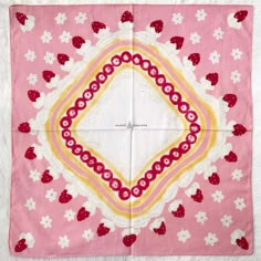 a pink and yellow square with hearts on it