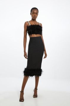 Master Every Party Look In Our Midi Skirt, Featuring Floating Feathers Adorning The Hemline, And A Fit That Flaunts The Figure. Style It With A Crop Top For A Casual Approach, Or With The Matching Top And Heels For An Occasion Look. Figure Form Bandage Knit Feather Hem Midi Skirt Flattering, High Waistline Statement, Feathered Trim Thigh High Leg Split Midi Length Zip Back Fastening Matching Top Sold Separately Bride Jumpsuit, Cocktail Skirt, Petite Wedding Guest Dresses, Sequin Coats, Cocktail Skirts, Plus Size Workwear, Skirt Collection, Summer Bridesmaid Dresses, Feather Skirt