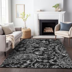 a living room area with couches, chairs and a rug in black and white