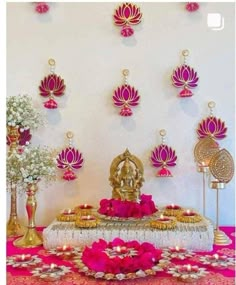 a decorated table with pink and gold decorations