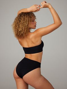 Seamless Bandeau Bralette in Black | SAVAGE X FENTY Stretch Tube Top With Removable Bra Pads, Seamless Solid Bandeau Bra, Smoothing Bandeau Solid Tube Top, Solid Smoothing Bandeau Tube Top, Smoothing Solid Bandeau Tube Top, Seamless No-show Bra For Shapewear, No-show Seamless Shapewear Bra, Seamless Compressive No-show Bra, Solid Color Bandeau Shapewear