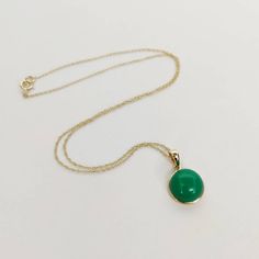 You can choose your own gem in my store. Let me know if you would like to see options Details of the pendants: Chrysoprase pendant Stone Weight: 7.10 carats Stone size and shape: 12 mm and round Metal: GOLD Purity: 14K (58.33%) approx Gold Weight: 0.51 grams Gross Weight: 1.93 grams Chrysoprase necklace pendant. These pendants are absolutely perfect for daily wear as they are light and definitely stylish This dainty pendant can be used in layers with other pendants. The initial price is for pend Jade Gemstone Necklace In Yellow Gold, Yellow Gold Jade Gemstone Necklace, Yellow Gold Jade Jewelry With Cabochon, Green Emerald Cabochon Necklaces, Green Emerald Cabochon Necklace, Formal Yellow Gold Jade Necklace, Formal Green Cabochon Necklace, Green Fine Jewelry Necklace With Polished Finish, 14k Gold Green Cabochon Jewelry