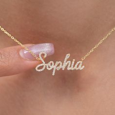 "This 14k personalized diamond name necklace is the perfect gift for the bridal party, someone special, or yourself.  How to order 1- Pick the fonts you like and send us a message 2- We will send you a picture of your name with the fonts you chose 3- If you like it any of them, place your order. 4- We send a final 3d mock up for approval. 5- Once approved we go ahead and finish your necklace. M A T E R I A L & L E N G T H Available in 14k Yellow Gold, 14k Rose Gold, 14k White Gold, Sterling Silver Stone: Natural Diamond Thickness: 1.2mm / 0.05\" Initials Lowercase: 4.5-5.5 mm Capital: 9-11 mm Diamond: 0.15 ct. - 0.60 ct. depending on the name Chain Length:  14+2, 16+2, 18+2 options or any length up to 20 inches without extension. (Please leave a note for the chain length) Color: G  Quality Initials Cubic Zirconia Name Necklace As Gift, Initials Cubic Zirconia Name Necklace For Gift, Personalized Name Necklace, Personalized Yellow Gold Diamond Necklace Gift, Personalized Yellow Gold Diamond Necklace For Gift, Diamond Name Necklace For Gift, Personalized Cubic Zirconia Nameplate Necklace, Personalized Diamond Nameplate Necklace, Elegant Personalized Diamond Necklace Gift