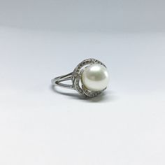 Our Ring Is Designed With White Freshwater Pearl in Round Shape, Cubic Zirconia And 925 Sterling Silver. You Can Wear It All Day Long. *Jewelry: Pearl ring *Size Of Ring: 14mm Length X 14mm Width X30mm height *Ring Size: Free size *Pearl Type: Freshwater Pearl *Pearl Grade: AAA *Pearl Luster: Excellent *Pearl Surface: Clean *Pearl Shape: Round/*Button *Pearl Color: *White/ Grey/ Pink /Black *Pearl Size: Approx 9-10mm *Metal: 925 Sterling Silver *Nice Jewelry Box Thanks For Choosing Blest Jewelle Elegant Sterling Silver Halo Ring, Fine Jewelry Sterling Silver Pearl Ring With Oval Shape, Oval Sterling Silver Pearl Ring, Oval Sterling Silver Pearl Ring In Fine Jewelry Style, Fine Jewelry Oval Pearl Ring In Sterling Silver, Timeless Sterling Silver Pearl Ring In Silver, Timeless Silver Sterling Silver Pearl Ring, Timeless Silver Pearl Ring In Sterling Silver, Cubic Zirconia Pearl Ring With Diamond Accents