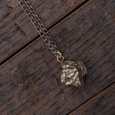 Add a stellar twist to your style with this long meteorite necklace! This men's or women's sterling silver pendant holds a small chunk of the campo del cielo meteorite and is strung on a30" black, gunmetal chain.Our 20" campo meteorite nugget necklace (SIG3040) is a more feminine option; it includes the same pendant strung on a shorter, polished sterling silver chain.In stock and ships within 1-3 days.DETAILS OF THE PENDANT Campo del Cielo Meteorite Metal: Sterling Silver Size: .5 - 1.5 Inches* Meteorite Necklace, Meteorite Jewelry, Mens Wedding Bands Unique, Jewelry By Johan, Meteorite Pendant, Meteorite Ring, Nugget Necklace, Pendant Bails, Black Chain