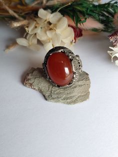 "Vintage 1920s Sterling Silver Art Deco Carnelian & Marcasite Ring Size is right about 5.75\" There is wear from age, please see pictures. **NOTE THAT THERE ARE SOME MISSING MARCASITE STONES**  Basic info: Size- Approx. 5.75\" US Color: Silver / Red Type- Silver work  Cut- Oval weight- approx. 7.8g Silver Mark-  Sterling Maker Mark - N/A  SHIPPING: All orders are guaranteed to ship the same or following day. If your purchase occurs on a Sunday you may request UPS shipment as the post office is closed. Shipping in the United States usually takes 3-4 days" Vintage Collectible Rings With Large Stone, Vintage Rings With Large Stone For Collectible, Vintage Rings With Large Stone For Collectors, Vintage Rings With Natural Stones For Gift, Vintage Silver Carnelian Rings, Vintage Oval Crystal Ring With Large Stone, Vintage Crystal Ring With Cabochon, Antique Carnelian Ring As Gift, Vintage Silver Crystal Ring With Natural Stones