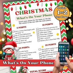 a person holding up a phone next to a christmas list