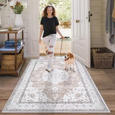 a woman walking her dog on a rug