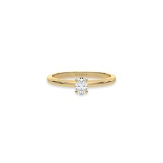 This yellow gold ring features an oval solitaire diamond elegantly secured in a four-prong setting on a solid gold band in top view Classic Oval Single Diamond Wedding Ring, Classic Radiant Cut Diamond Ring, Classic Oval Ring With Center Stone, Oval Solitaire Diamond Ring For Formal Occasions, Classic Oval Diamond Ring With Center Stone, Timeless Yellow Gold Wedding Ring With Oval Shape, Classic Oval Diamond Ring As Gift, Classic Oval Diamond Ring Gift, Oval Yellow Gold Diamond Ring With Single Diamond