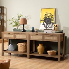 a living room scene with focus on the coffee table and vases in the foreground