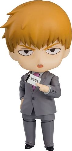 an action figure is holding a small item in his hand and looking at the camera