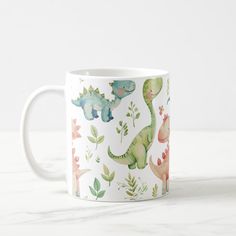 a coffee mug with dinosaurs and plants on it