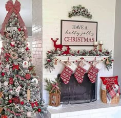 a decorated christmas tree in front of a fireplace