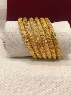 Christmas Gift, Holiday Gift,  24k gold plated Bangles, Indian Bridal Bangles, Handmade Bracelet for Women Gold Bangles for Women - Indian Bridal Bangles - Handmade Bracelet These stylish bangles feature a classic bangle design and are available in gold color. Material: High quality 24k gold plated bangles ( Not solid gold) Diameter: 2.48inches Can open Lead & Nickel free Tarnish resistant Hypoallergenic Yellow Gold Plated Bangle For Puja, Gold Plated Bangle For Puja, Gold Plated Bangle Bracelet For Festivals, Gold Plated Bangle For Puja And Festivals, Gold Round Jewelry For Puja, Traditional Gold-plated Bracelet For Puja, Round Gold Jewelry For Puja, Ceremonial Gold Plated Bracelets For Festivals, Festive Round Gold-plated Bracelet