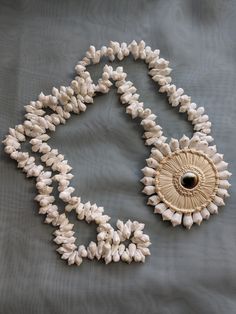 Vintage beach jewelry shell Operculum costume jewelry necklace for the summer.  Good vintage condition. White Shell-shaped Shell Necklace, Unique Shell-shaped Shell Necklaces, Handmade White Shell Necklaces, Unique White Shell Pendant Necklace, Unique White Pendant Shell Necklace, White Shell Pendant Necklace For Beach, Traditional Shell-shaped Beach Jewelry, White Pendant Shell Necklace For Beach, Adjustable Shell Pendant For Beach