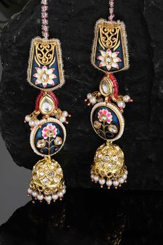 Product Features: Color: Blue, Pink, Gold, White Material: Alloy Metal Design: Kundan, American Diamonds, Pearls, Natural Stones Other Details: Gold-Plated Dimension: Length of Earring= 10 CM; Width of Earring =2.8 CM; Length of Kanchain =10 CM; Width of Kanchain = 1 CM; Adjustable - No Occasion: Party Product Type: Hair Chain Disclaimer: There will be slight difference in digital to actual image Heavy Blue Earrings For Festive Occasions, Festive Heavy Blue Earrings, Festive Blue Earrings, Blue Chandbali Jewelry With Cutdana Detail, Blue Chandbali Jewelry With Cutdana, Blue Jhumkas With Tilla For Festivals, Blue Tilla Jhumkas For Festivals, Blue Cutdana Jewelry For Diwali, Blue Cutdana Chandbali Jewelry