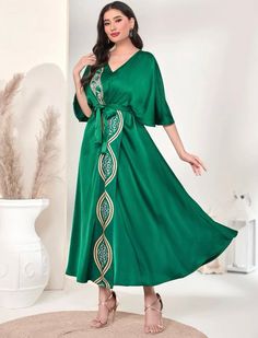 Indulge in opulence with our elegant green batwing kaftan dress, embellished with intricate floral motifs. Crafted from premium 100% polyester, it showcases a belted waist, a flattering V-neck, and a flared hem that highlights the elevated waistline. Effortlessly maintain this dress with machine wash capabilities, making it an ideal addition to any refined wardrobe. Now available in US sizes 4 - 12. This item ships immediately worldwide! Please note that this item is Final Sale, and no returns o Comfy Summer Dresses, Junior Party Dresses, Black Lace Mini Dress, Milly Dress, Black Striped Dress, Tie Front Dress, Butterfly Dress, Dresses Elegant, 70 Dress