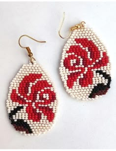 two pairs of red and white beaded earrings with roses on the front, one has gold earwires