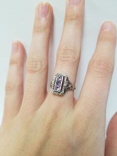 Once in a Blue Moon beautiful vintage finds. Amethyst Filigree Ring // Solid 925 Sterling Silver. Antique Remake. There are three 0.08 ct stones in a beautiful filigree setting. Beautiful anniversary present, Mother's Ring, or Birthday gift. Size: 6, 7, 8 US* Total Carat Wt: 0.24 ct Band width: 1.6 mm *Ring sizes may be 1/4 smaller than size selected Free Shipping & packaged in a black velvet ring box ready to gift! Vintage Gemstone Rings For Anniversary, Vintage Silver Diamond Ring With Gemstone, Vintage White Gold Gemstone Ring, Vintage Emerald Cut Ring As Gift, Vintage Emerald Cut Ring For Gift, Vintage White Gold Promise Ring Jewelry, Fine Jewelry Birthstone Collectible, Antique Sterling Silver Jewelry With Birthstone, Antique Sterling Silver Birthstone Jewelry