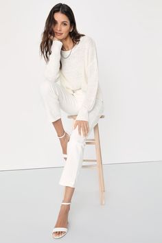 Grace everyone with your good energy in the Lulus Positive Presence Ivory Loose Knit Sweater! Medium-gauge loose knit shapes this must-have pullover sweater that has a rounded neckline, long sleeves with drop shoulders, and a relaxed-fit bodice. Notched hem creates a high-low effect for a stylish finishing touch! Fit: This garment fits true to size. Length: Size medium measures 23.5" from shoulder to hem. Bust: Great for any cup size. Waist: Not Fitted - comfortable room throughout midsection. U Chic Oversized Pointelle Knit Sweater, White Chunky Knit Sweater For Loungewear, White Long Sleeve Knit Top For Work, Chic Oversized Pointelle Knit Top, Oversized Pointelle Knit Chic Top, Versatile White Long Sleeve Knit Top, White Long Sleeve Versatile Knit Top, Oversized White Soft Knit Top, White Textured Knit Sweater For Loungewear