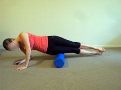 a woman is doing push ups on a blue ball